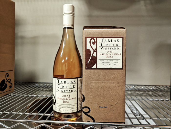 Boxed wine next to a bottle Boxed wine next to a bottle