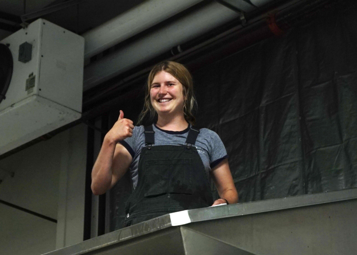 Harvest Intern Louisa Cleaning the Press Harvest Intern Louisa Cleaning the Press