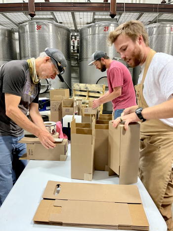 Cellar team making Patelin red boxes Cellar team making Patelin red boxes