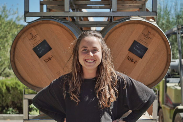 Kayja Mann in front of barrels at Tablas Creek Kayja Mann in front of barrels at Tablas Creek