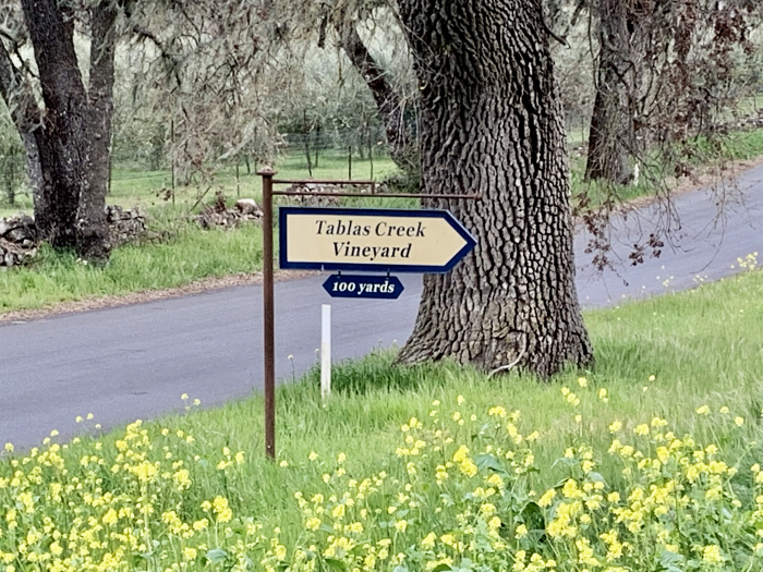 Tablas Creek sign with wildflowers Tablas Creek sign with wildflowers