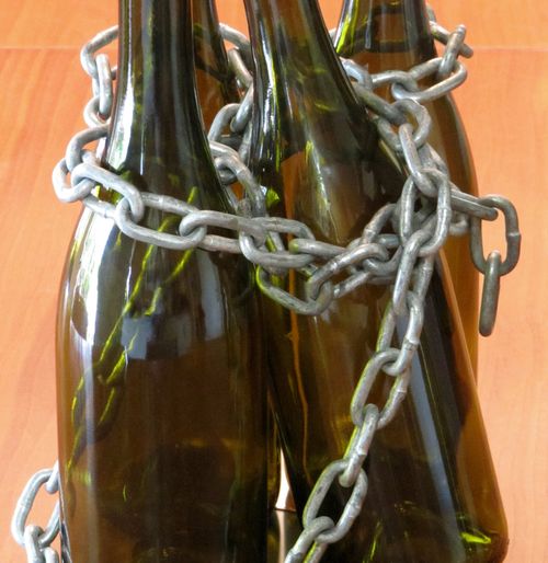 Wine bottles in chains Wine bottles in chains
